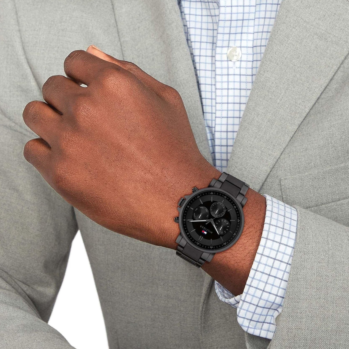 Tommy Hilfiger TYSON multifunction watch worn on wrist with business casual attire