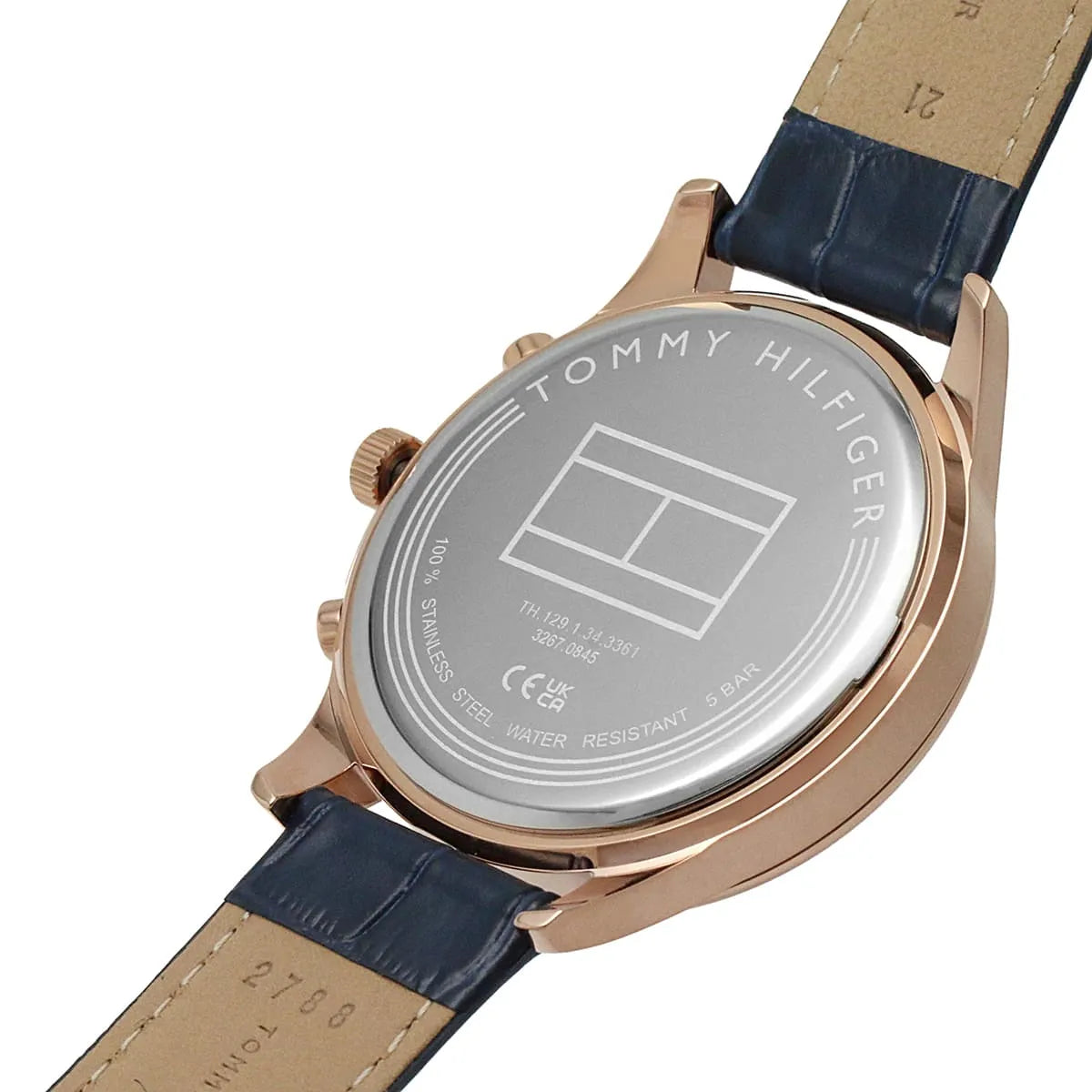 Case back showing Tommy Hilfiger branding and watch specifications