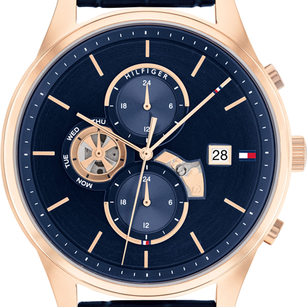 Close-up of blue dial with chronograph subdials, open tourbillon and date window