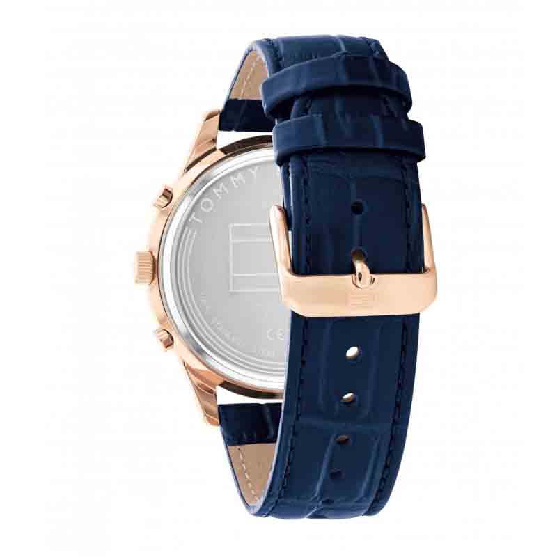 Detail of blue crocodile-textured leather strap with rose gold buckle