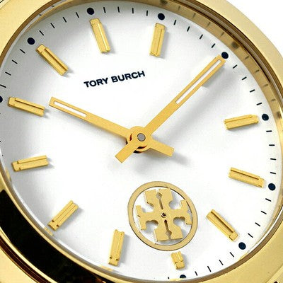 Tory Burch Collins dial detail with gold-tone markers, Tory Burch text, and logo subdial