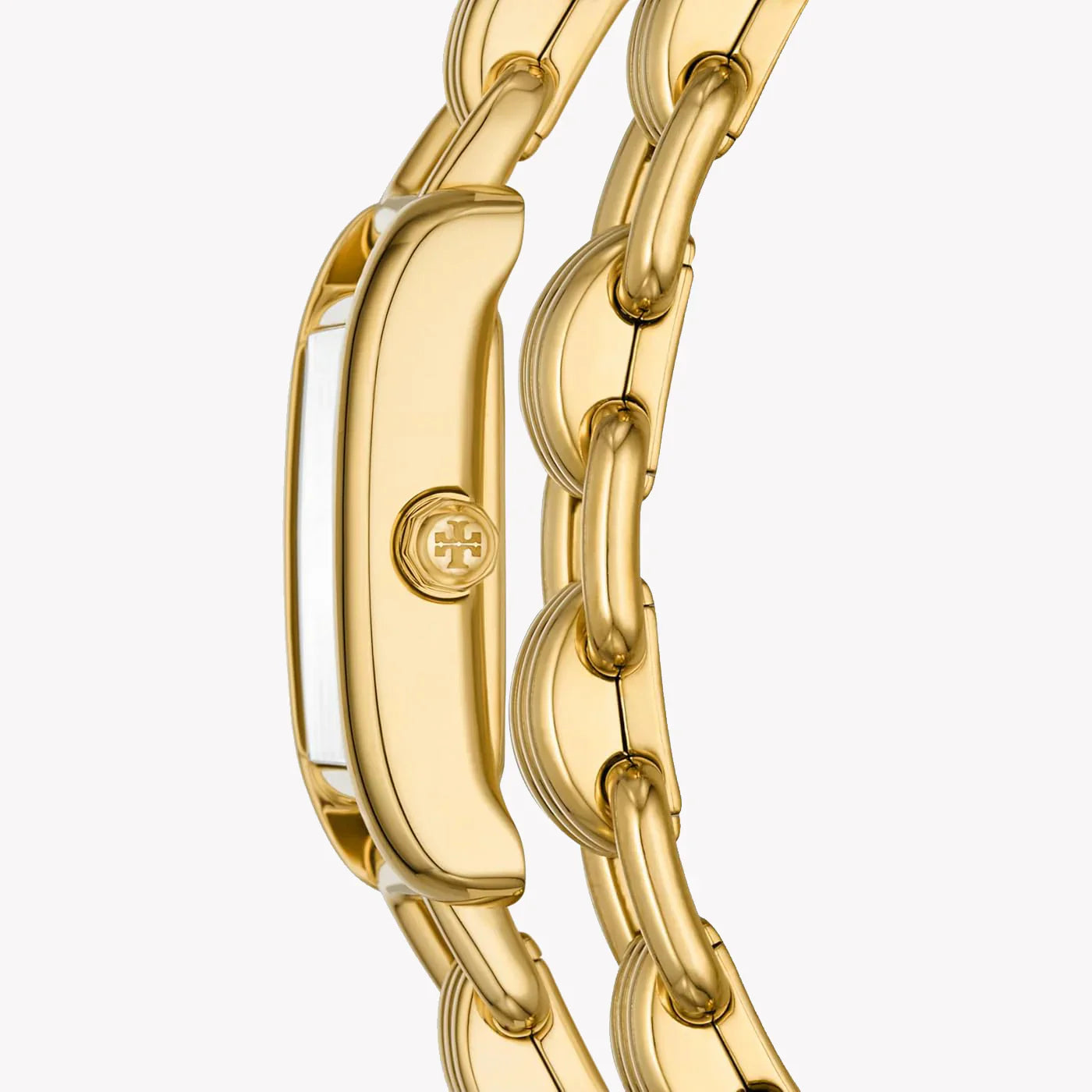 Angled view of Tory Burch Mini Eleanor gold case and double wrap bracelet detail