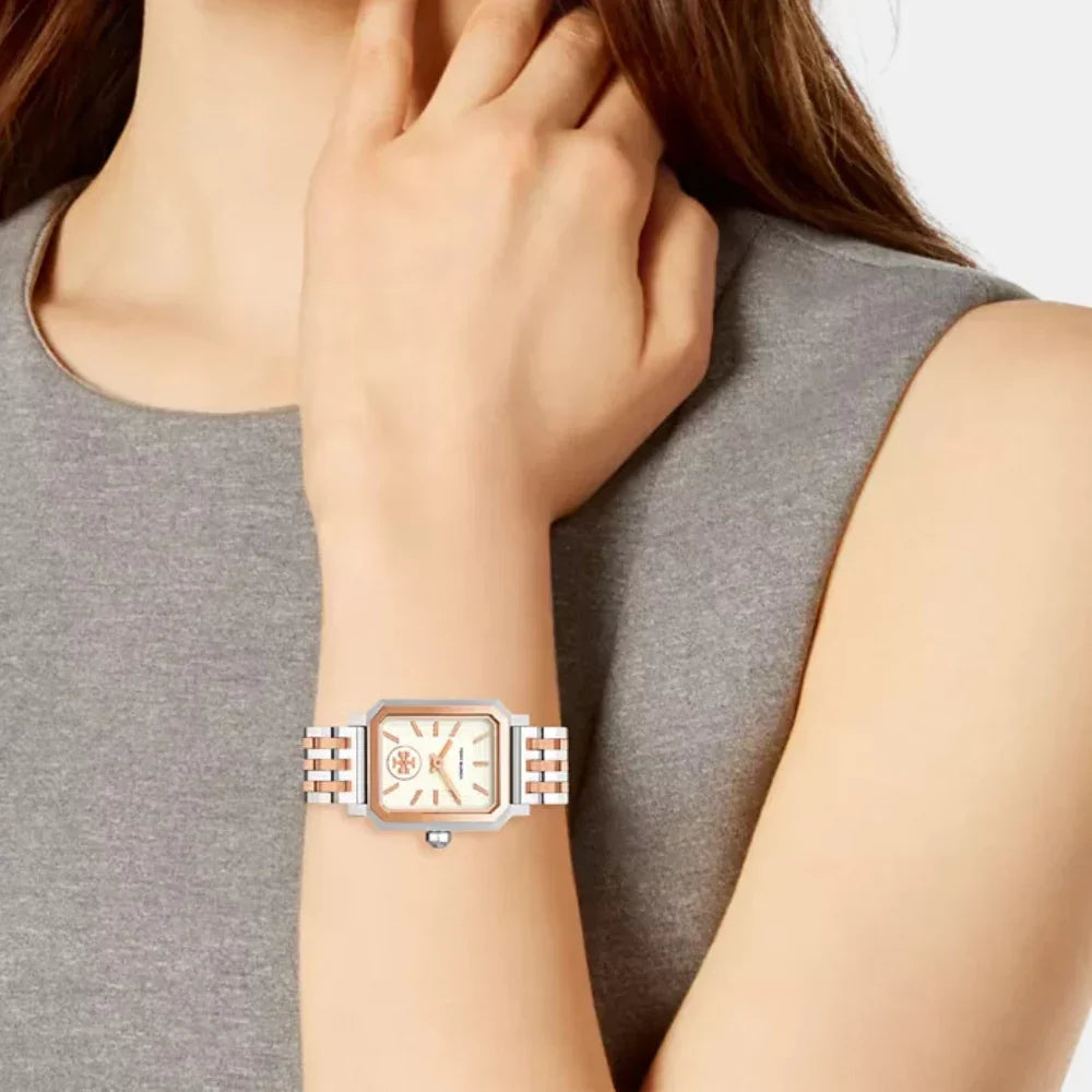 Tory Burch Robinson rose gold and silver stainless steel watch worn on wrist
