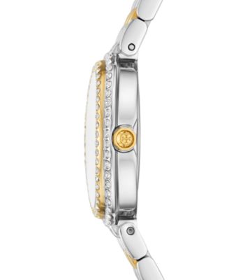 Side profile of Tory Burch oval watch showing crystal bezel and bracelet
