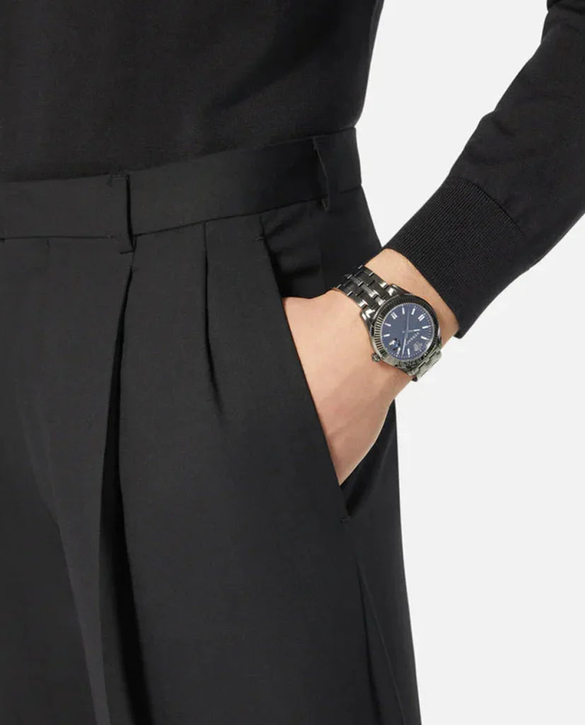 Versace Greca Time watch worn on wrist with black dial visible