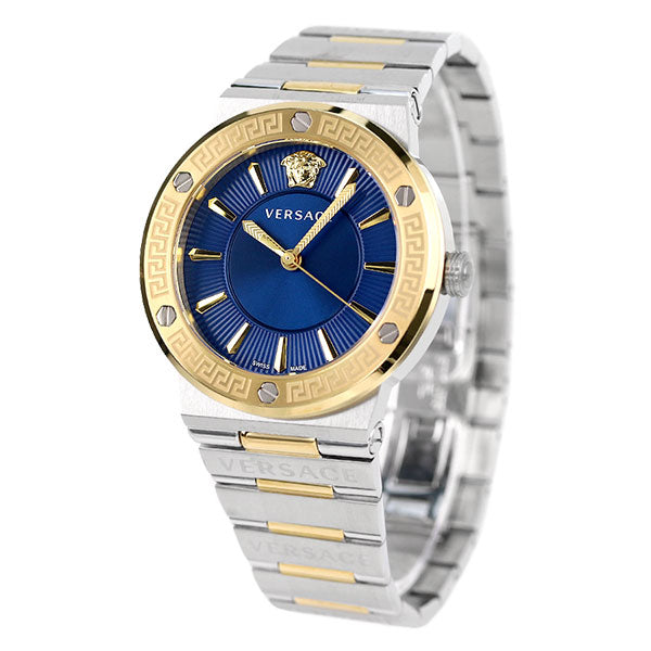 Angled view of Versace Greca watch showing blue sunburst dial and two-tone metal bracelet