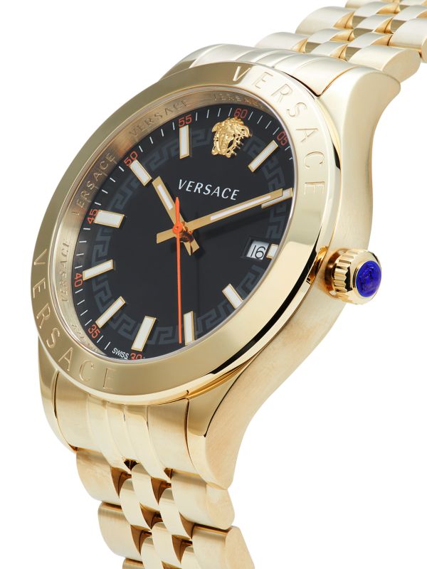 Versace Hellenyium gold watch angled view showing dial, bezel, and matching gold bracelet