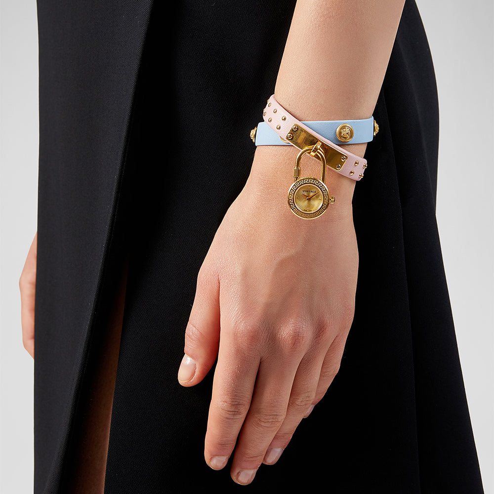 Versace Medusa Lock Icon watch worn on wrist with interchangeable blue and pink straps