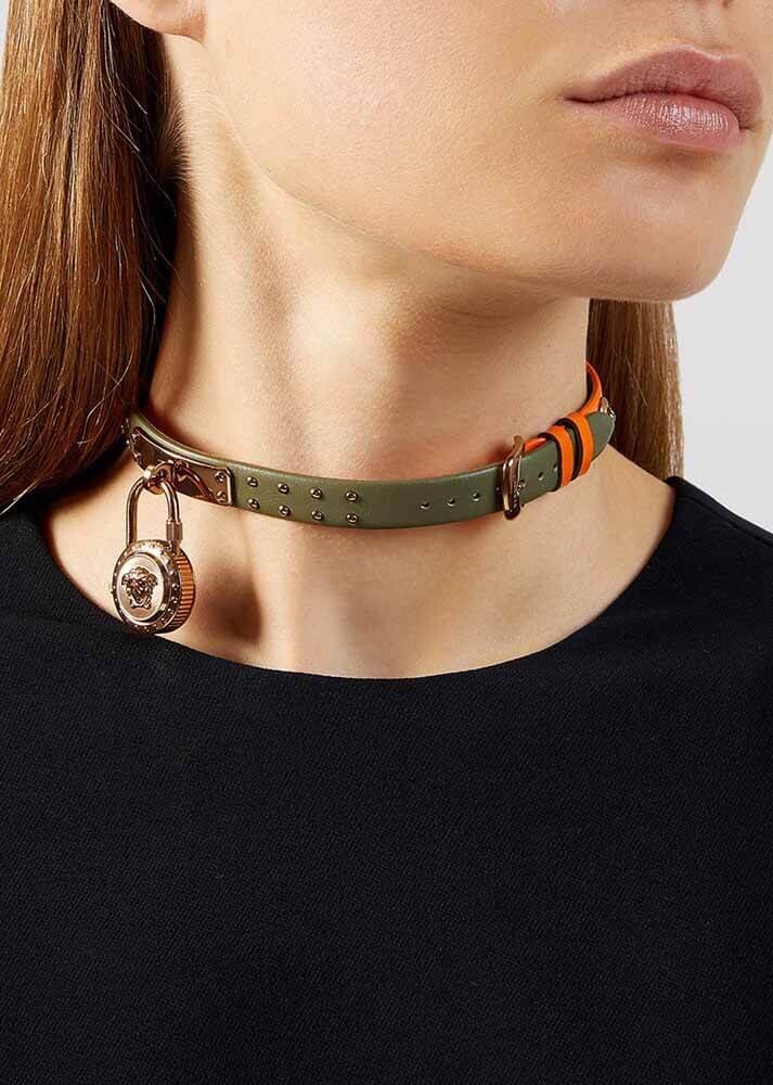 Versace Medusa Lock Icon watch worn as necklace-style bracelet around neck with green strap
