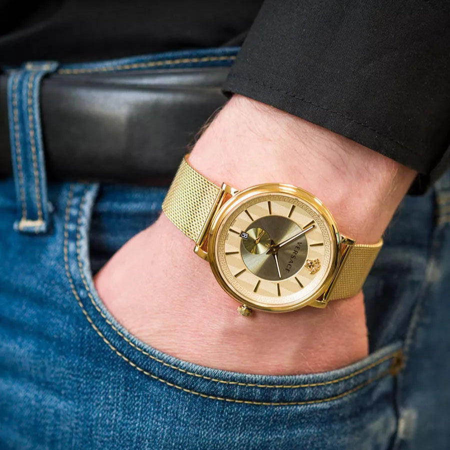 Versace V-Circle automatic watch worn on wrist showing yellow gold case and mesh bracelet