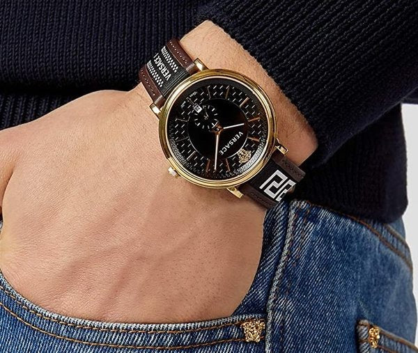 Versace V-Circle men's watch worn on wrist showing black dial and brown leather strap with Versace branding