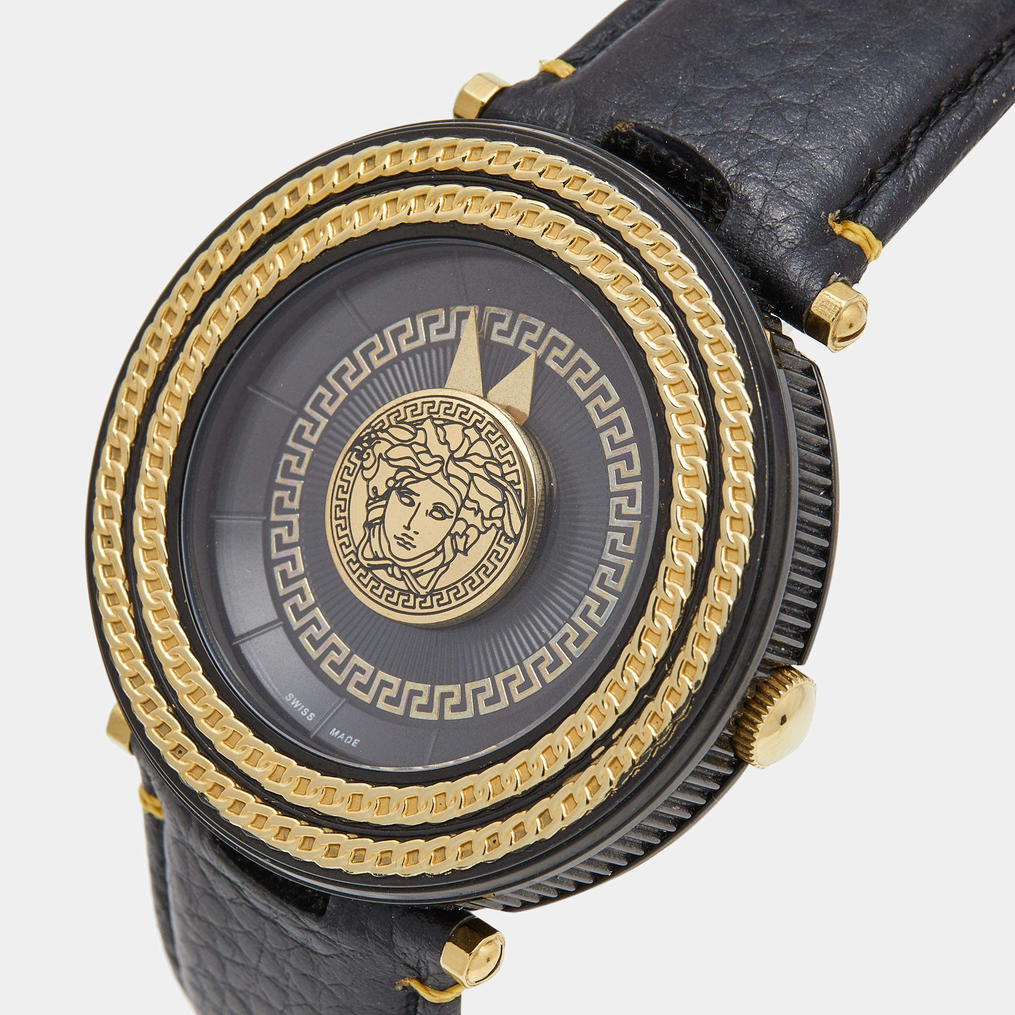 Versace V-Metal Icon watch at angle showing gold-tone bezel detail and Medusa medallion