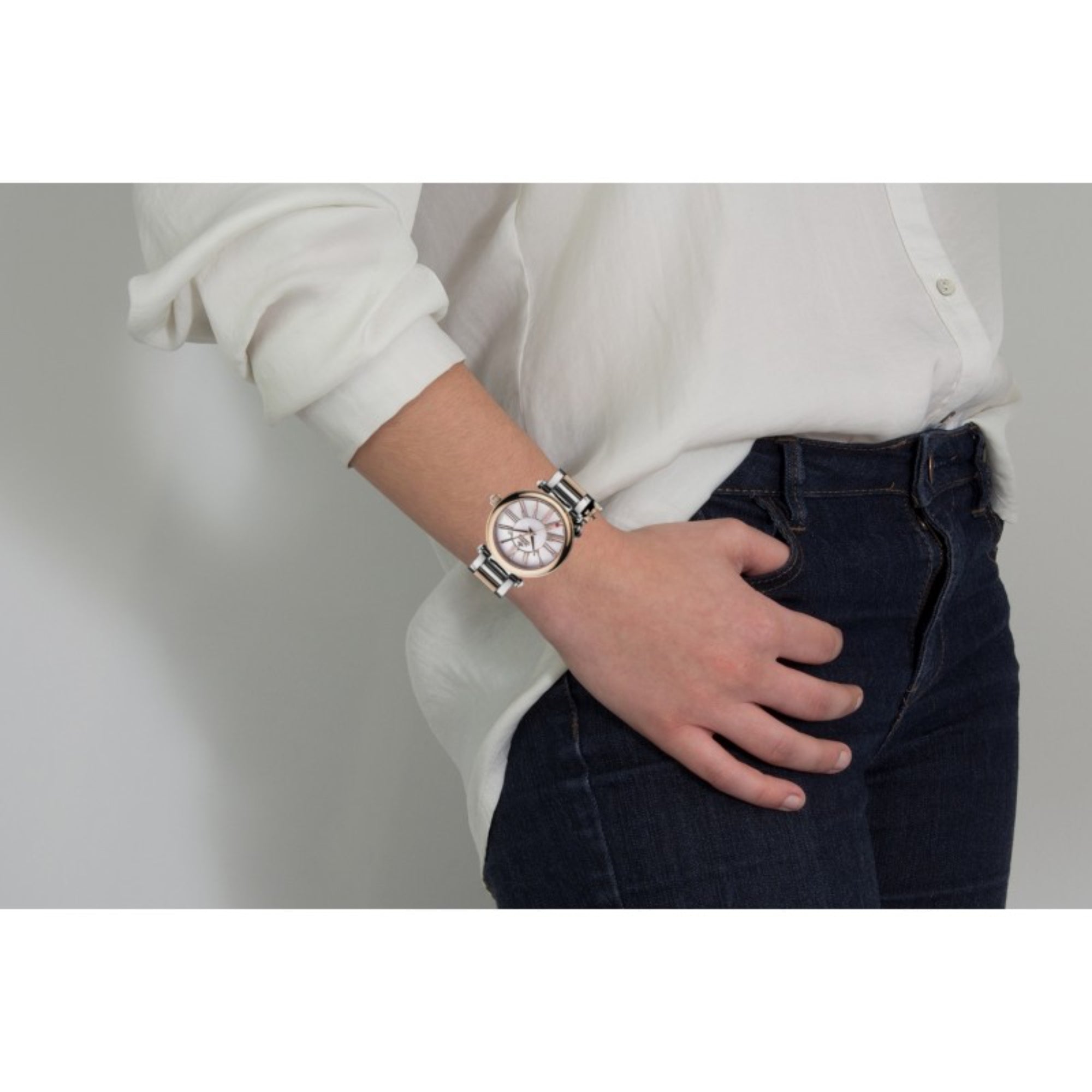 Vivienne Westwood Mother Orb watch worn on wrist, two-tone design with rose gold and silver tones