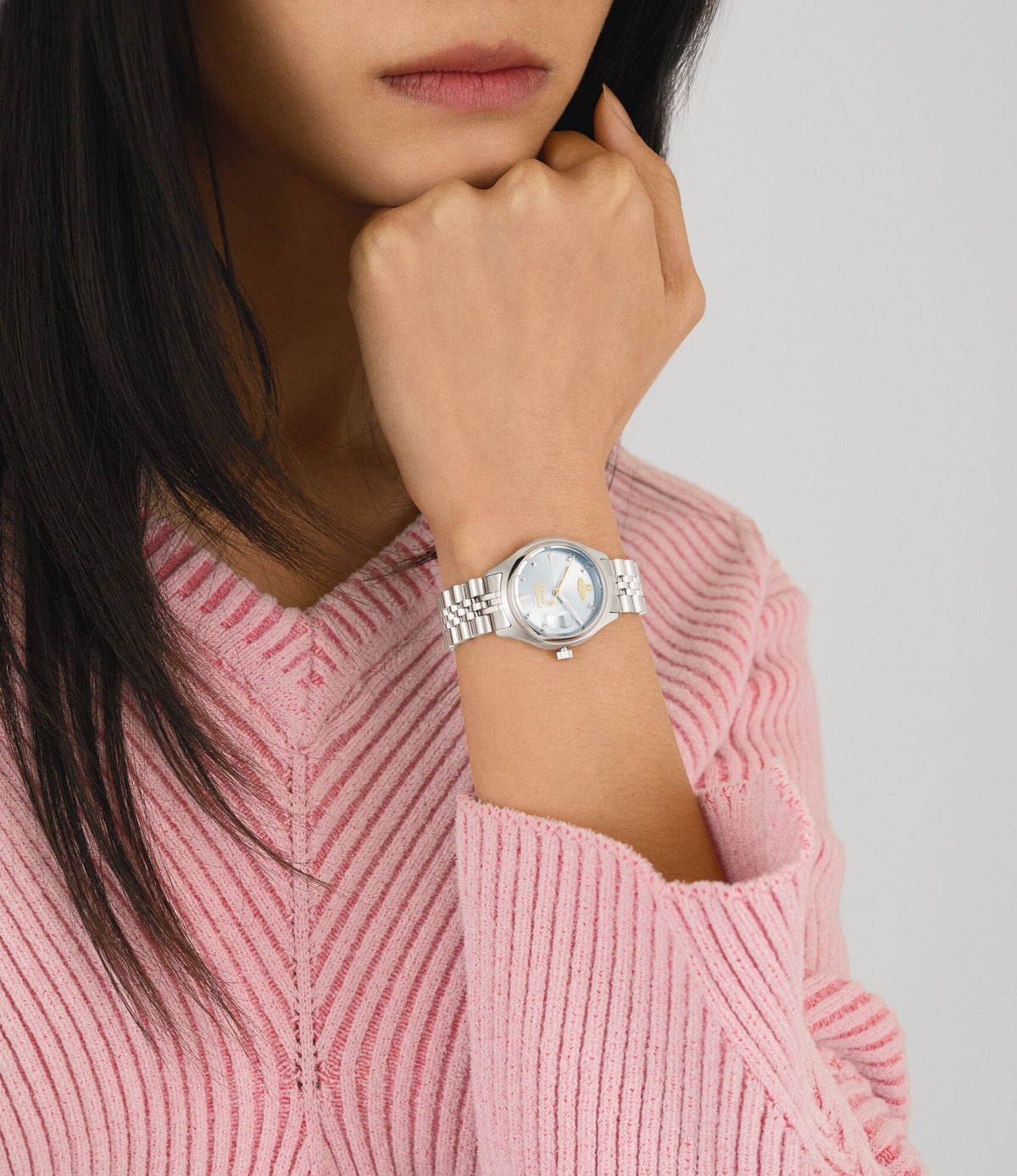 Close-up of Vivienne Westwood Bloomsbury watch on wrist with silver case and blue dial