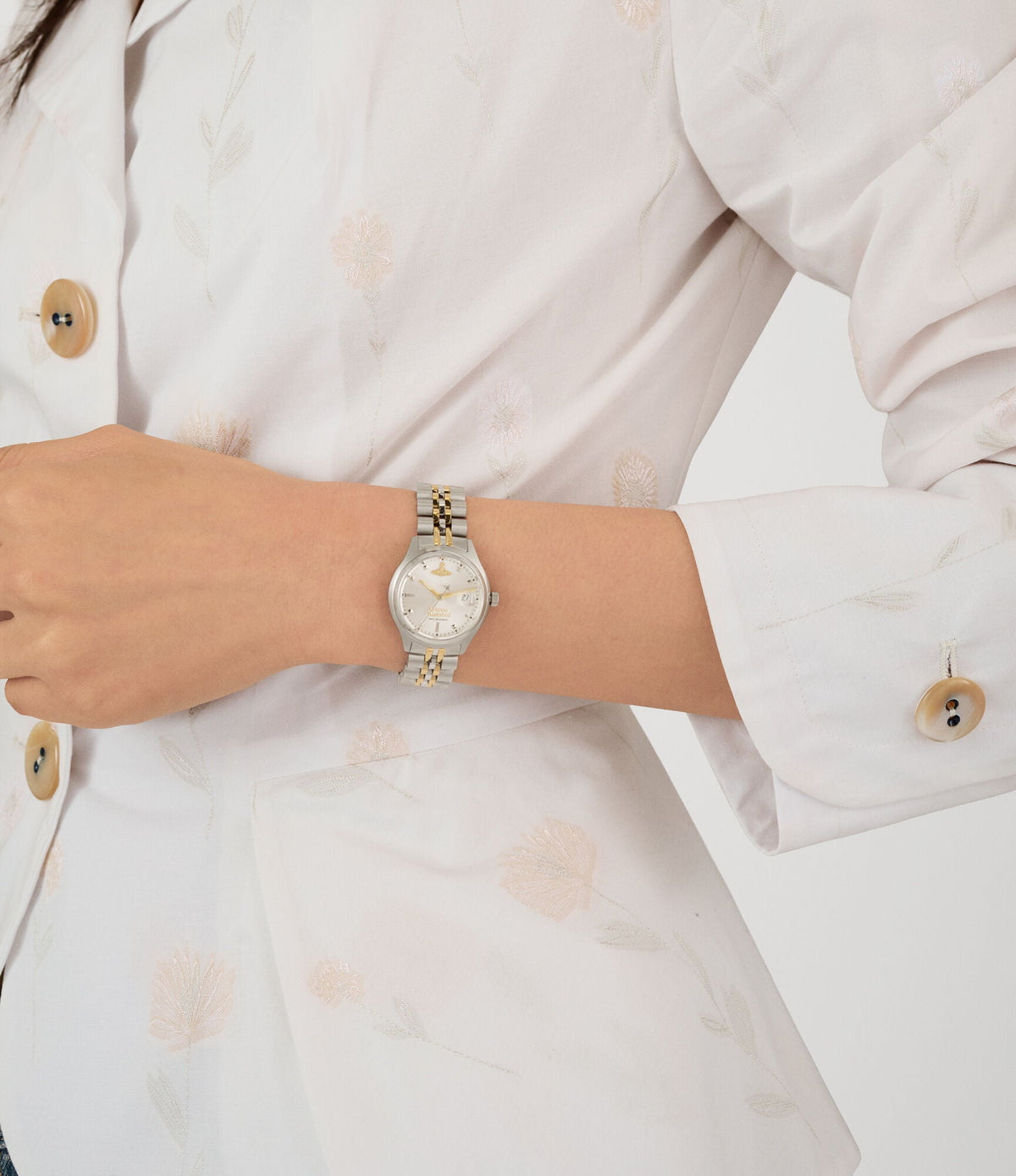 Vivienne Westwood Little Camberwell watch worn on wrist with silver dial and mixed metal bracelet